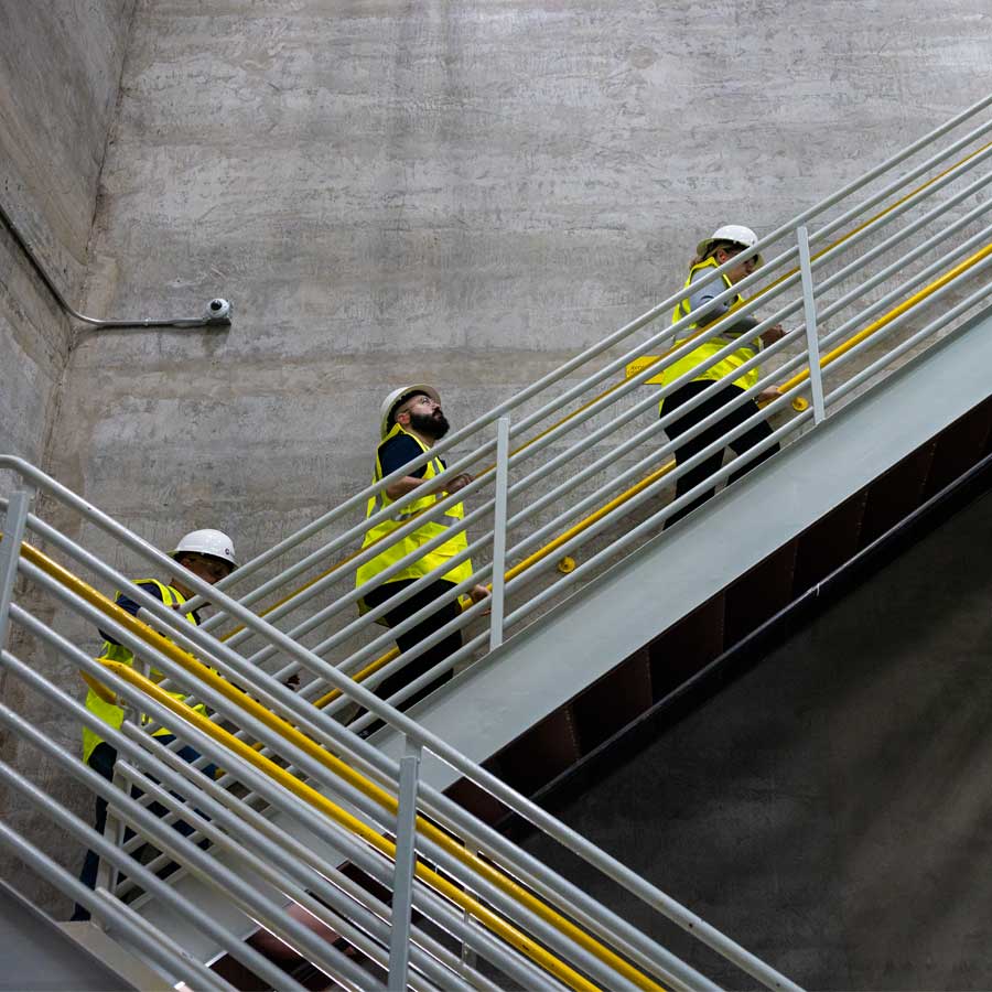 Employees walking up a staircase